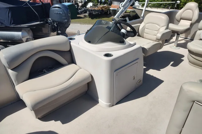 Slide: The Image of Interior of 2016 Sylvan Mirage Fish 8522 Party Fish 4.0 pontoon boat with beige seating. - 8
