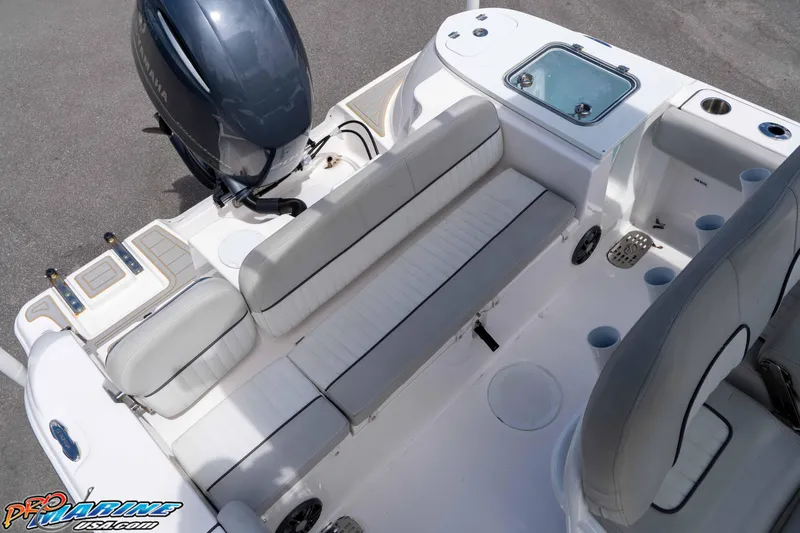 Slide: The Image of 2021 Sea Fox 228 Commander boat interior with seating and engine view. - 11