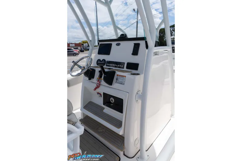 Slide: The Image of 2021 Sea Fox 228 Commander boat console with steering wheel and controls. - 12