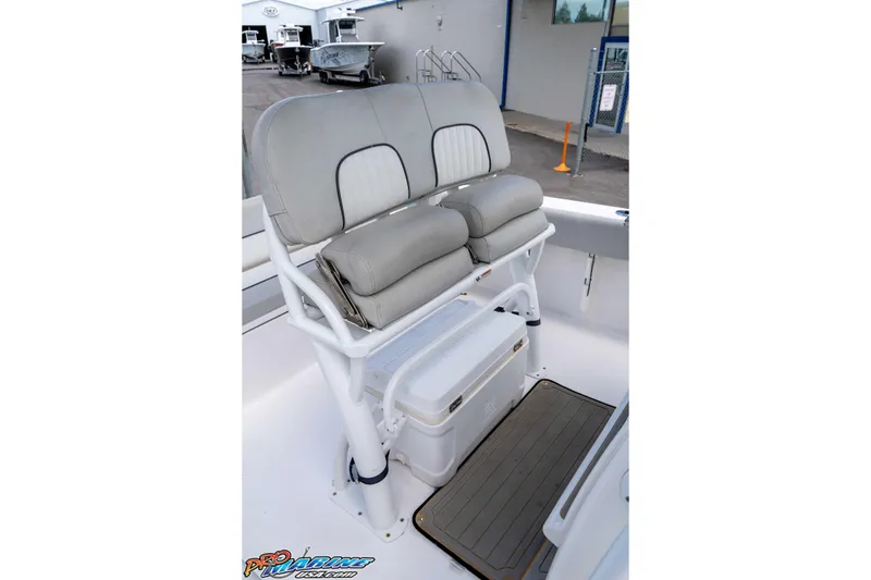 Slide: The Image of 2021 Sea Fox 228 Commander boat seating with storage and cooler on deck. - 14