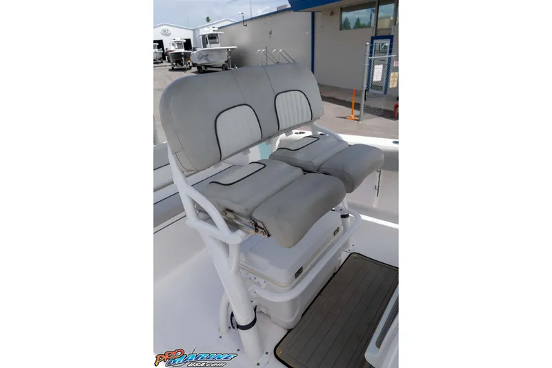 Slide: The Image of 2021 Sea Fox 228 Commander boat seating with cushioned dual seats and storage. - 15