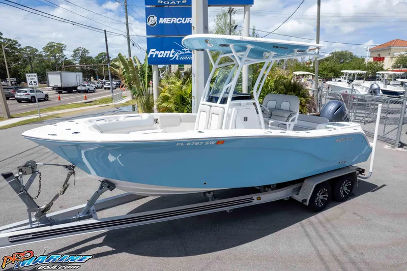 Slide: The Image of 2021 Sea Fox 228 Commander boat on trailer, displayed outdoors at a dealership. - 18