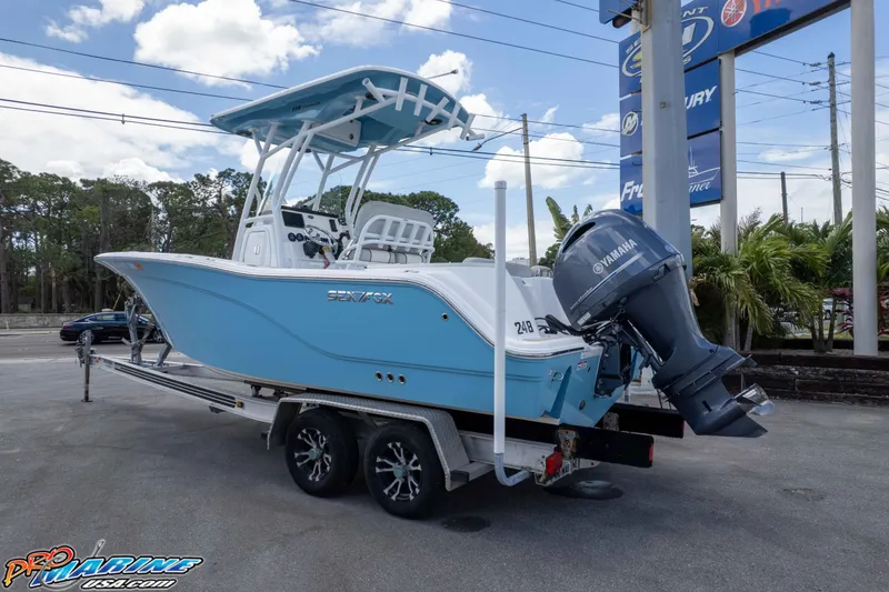 Slide: The Image of 2021 Sea Fox 228 Commander boat on trailer with Yamaha outboard motor, parked outdoors. - 19
