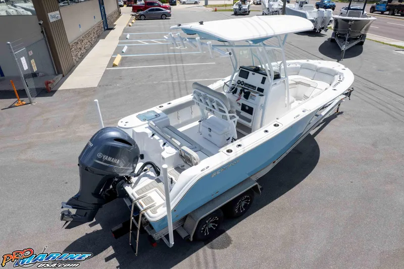 Slide: The Image of 2021 Sea Fox 228 Commander boat with Yamaha engine, parked on a trailer in a lot. - 22