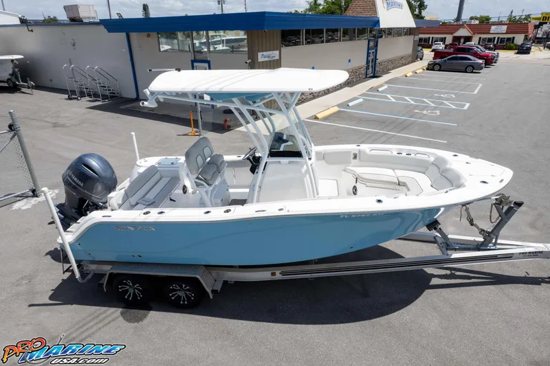 Slide: The Image of 2021 Sea Fox 228 Commander boat on trailer in parking lot, side view. - 23