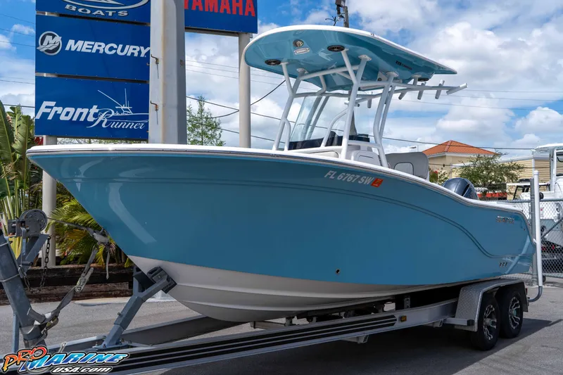 Slide: The Image of 2021 Sea Fox 228 Commander boat on trailer, displayed outdoors. - 3