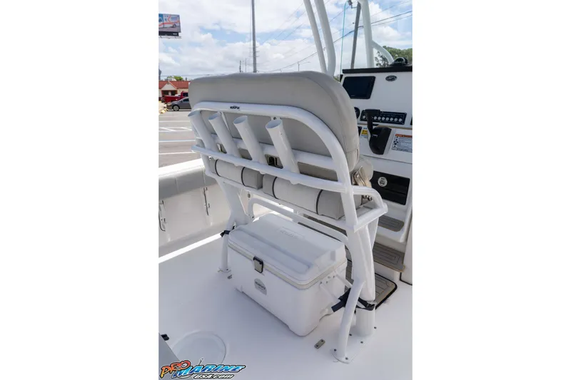 Slide: The Image of 2021 Sea Fox 228 Commander boat interior with rod holders and cooler storage. - 34