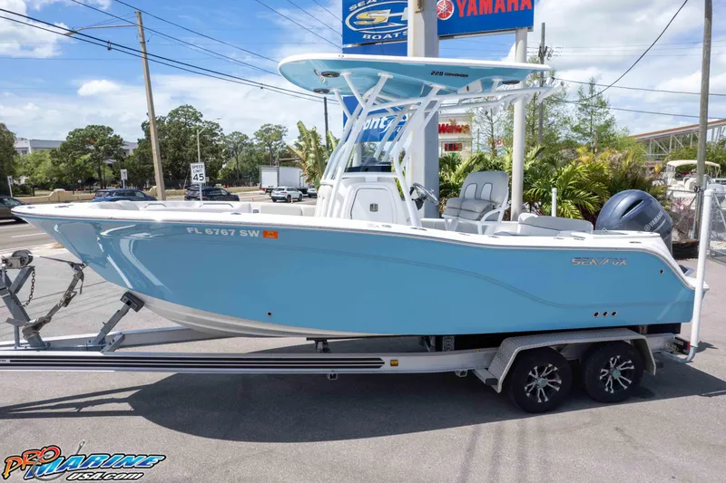Slide: The Image of 2021 Sea Fox 228 Commander boat on trailer, displayed outdoors with Yamaha engine. - 41