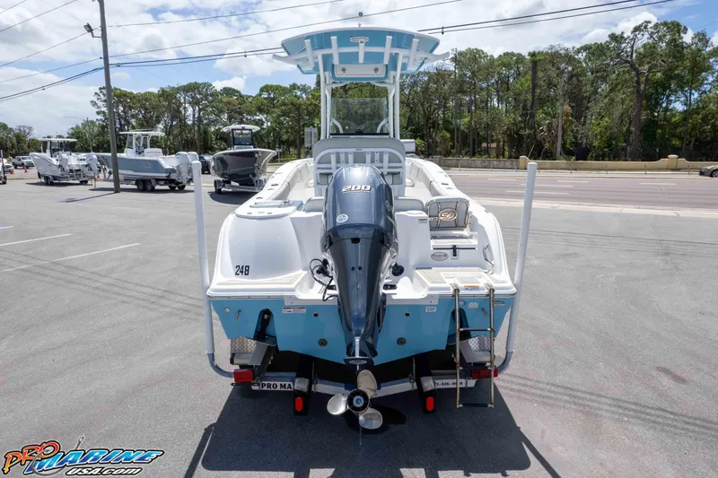 Slide: The Image of 2021 Sea Fox 228 Commander boat with Yamaha 200 engine, parked outdoors. - 43