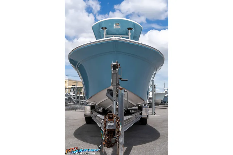 Slide: The Image of 2021 Sea Fox 228 Commander boat on trailer under blue sky. - 7