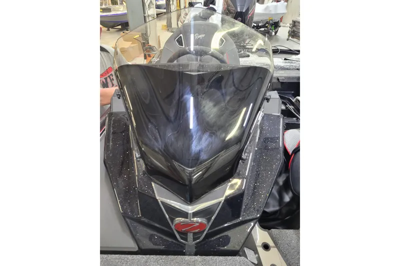 Slide: The Image of 2025 Ranger Z520R Cup-Equipped boat with sleek windshield design in a workshop setting. - 11