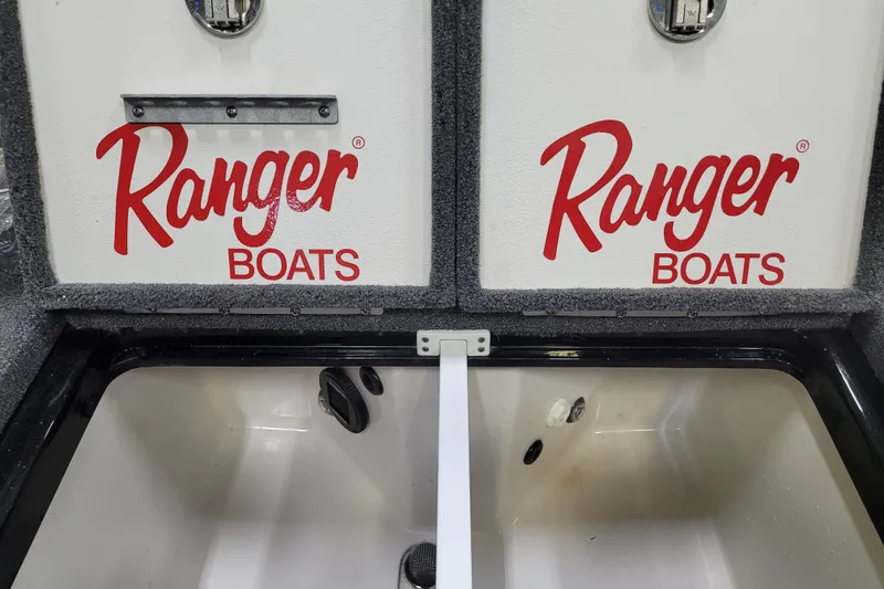 Slide: The Image of 2025 Ranger Z520R Cup-Equipped boat storage compartment with Ranger Boats branding. - 20
