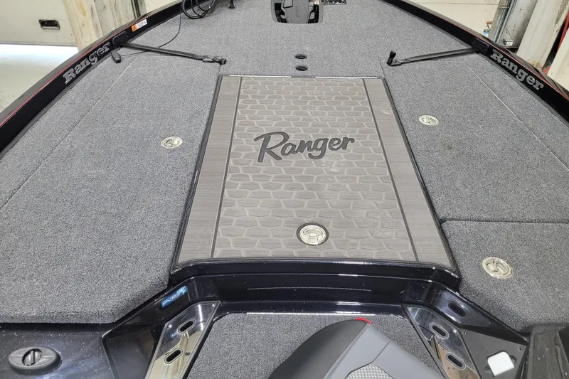 Slide: The Image of 2025 Ranger Z520R Cup-Equipped boat deck with textured flooring and storage compartments. - 22