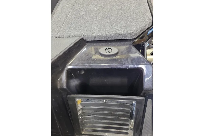 Slide: The Image of 2025 Ranger Z520R Cup-Equipped boat storage compartment with textured surface. - 24