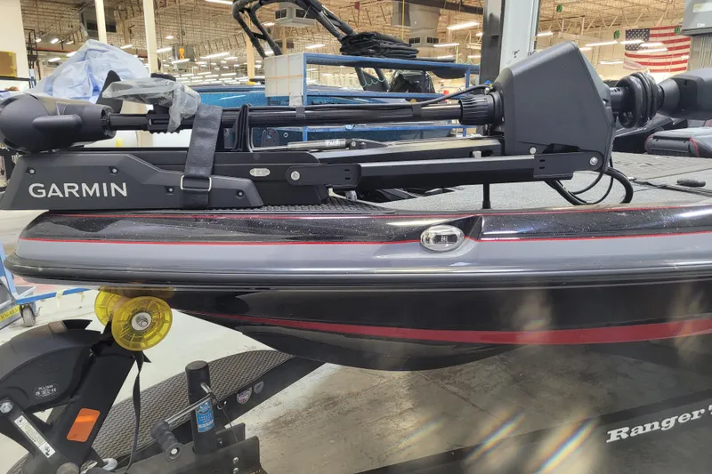 Slide: The Image of 2025 Ranger Z520R Cup-Equipped boat with Garmin equipment in a workshop setting. - 31
