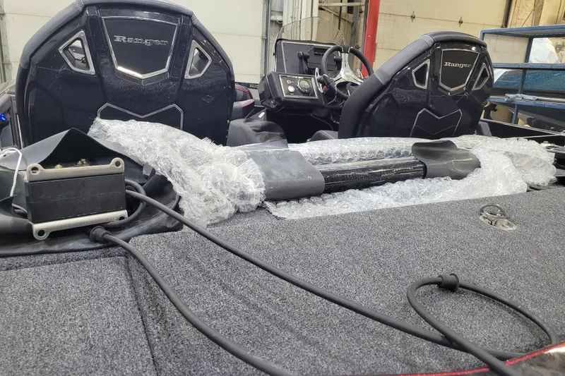 Slide: The Image of 2025 Ranger Z520R Cup-Equipped boat interior with wrapped components and visible dashboard. - 33