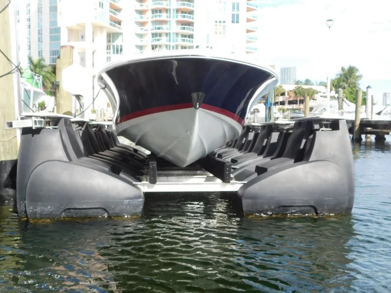 Slide: The Image of 2009 Chris-Craft Corsair 25 boat docked on a lift in a marina setting. - 22