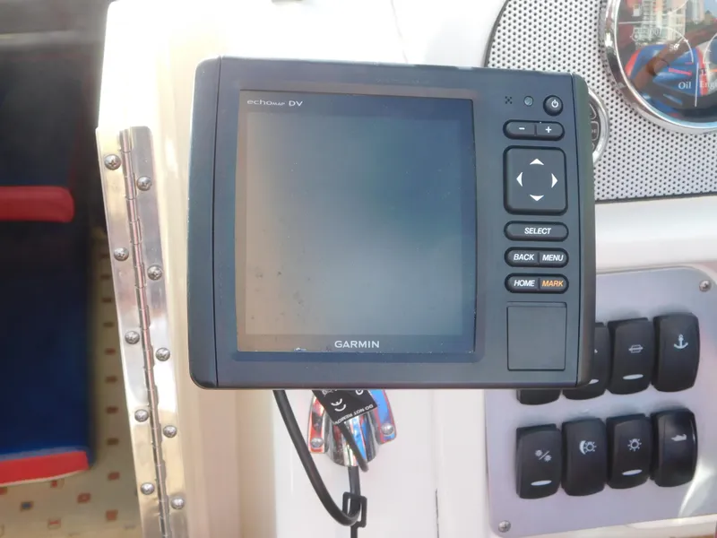 Slide: The Image of Garmin GPS device on 2009 Chris-Craft Corsair 25 boat dashboard. - 23