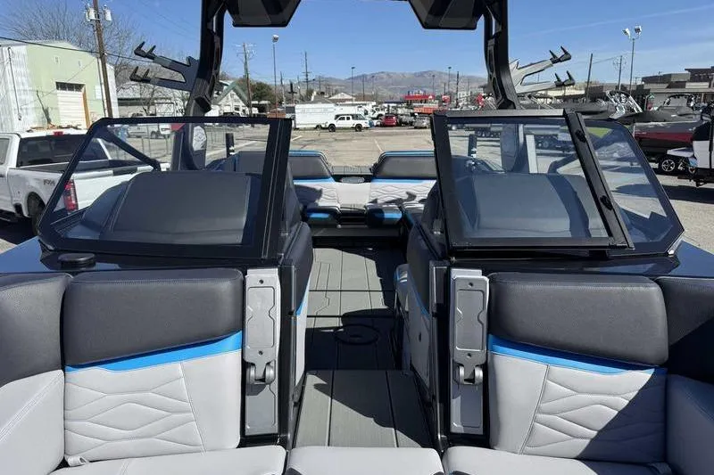 Slide: The Image of Interior of a 2026 Supra SL boat with modern seating and open windshield. - 12