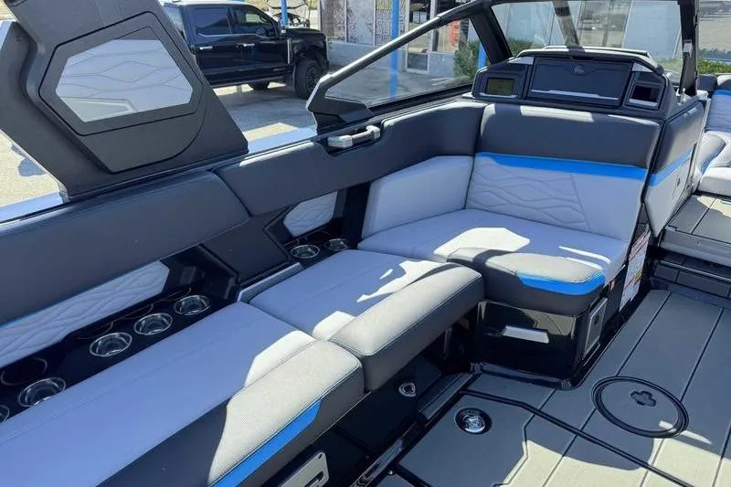 Slide: The Image of 2026 Supra SL boat interior with modern seating and cup holders. - 16