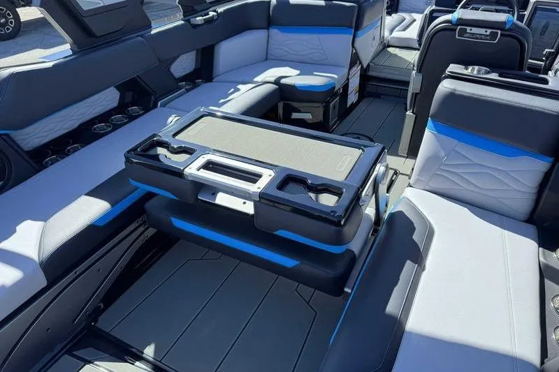 Slide: The Image of Luxurious interior of 2026 Supra SL boat with modern seating and table setup. - 7