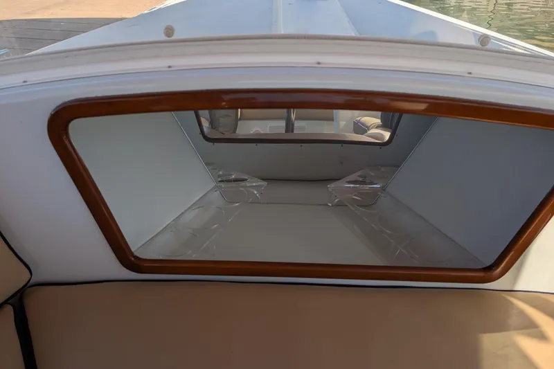 Slide: The Image of Interior view of a 2013 Duffy Snug Harbor 18 boat with seating and windows. - 5