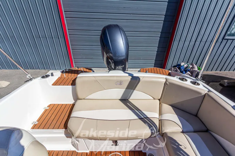Slide: The Image of 2017 NauticStar 193 SC boat interior with seating and outboard motor. - 12