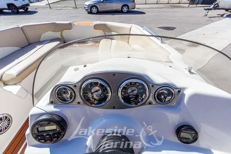 Slide: The Image of 2017 NauticStar 193 SC boat dashboard with gauges and controls at Lakeside Marina. - 16