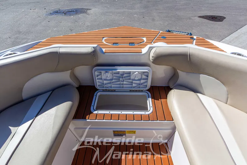 Slide: The Image of Interior view of 2017 NauticStar 193 SC boat with cushioned seating and storage compartments. - 21