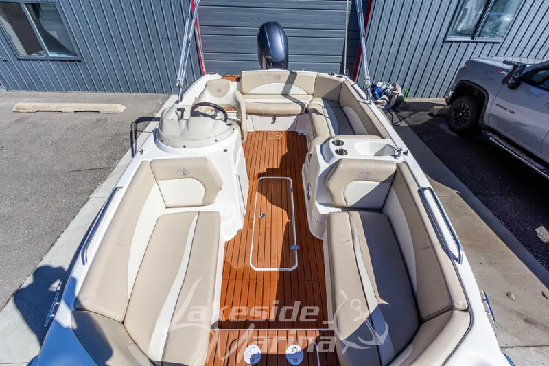 Slide: The Image of 2017 NauticStar 193 SC boat interior with beige seating and wood flooring. - 25