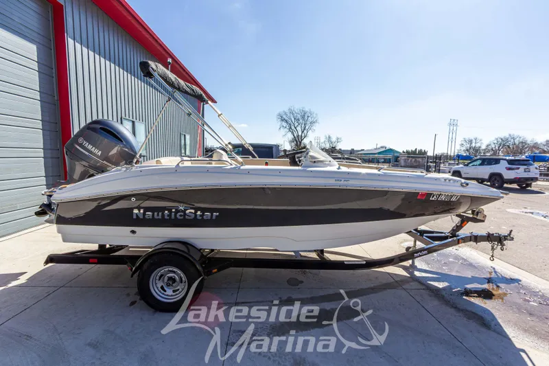 Slide: The Image of 2017 NauticStar 193 SC boat on trailer at Lakeside Marina. - 7