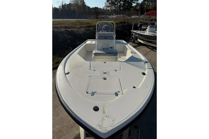 Slide: The Image of 2024 Mako 18 LTS boat, white deck, center console, outdoor setting. - 3