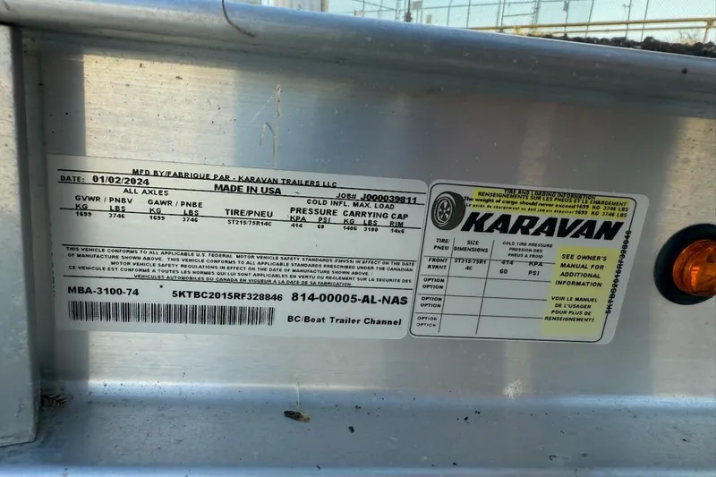 Slide: The Image of Label on a 2024 Mako 18 LTS trailer, detailing specifications and manufacturing information. - 9