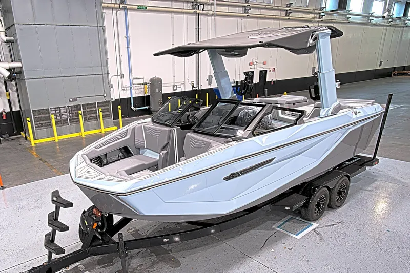 The Image of 2025 Nautique Super Air Nautique G23 Paragon boat on trailer in warehouse. - 1