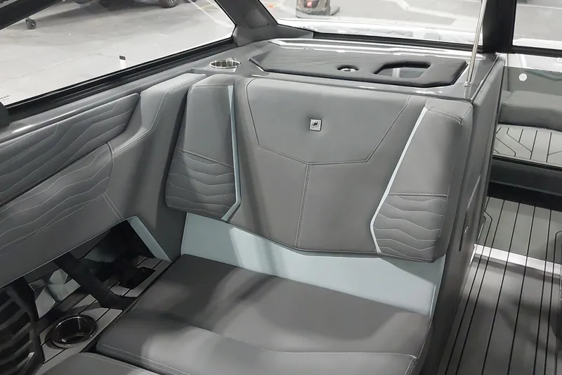 Slide: The Image of 2025 Nautique Super Air Nautique G23 Paragon interior with sleek gray seating design. - 11