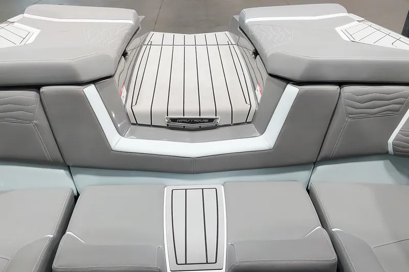 Slide: The Image of 2025 Nautique Super Air Nautique G23 Paragon interior seating, featuring sleek gray upholstery. - 14