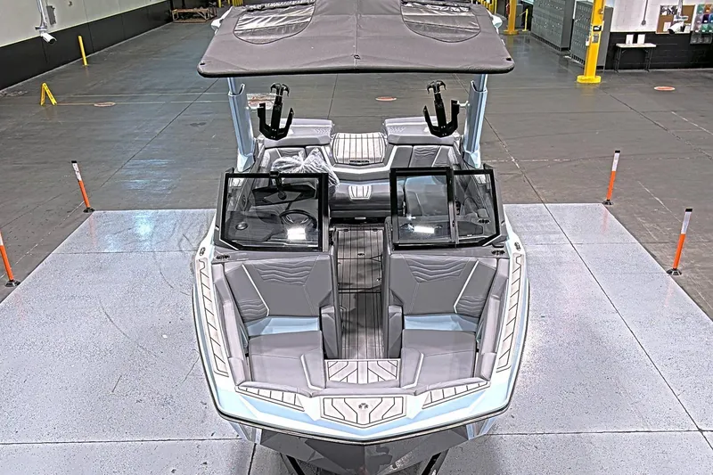 Slide: The Image of 2025 Nautique Super Air Nautique G23 Paragon boat in showroom, top view. - 5