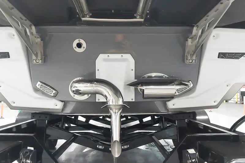 Slide: The Image of 2025 Nautique Super Air Nautique G23 Paragon boat stern with exhaust and hardware details. - 8