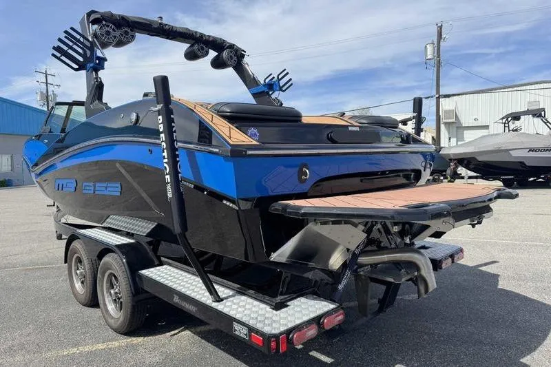 Slide: The Image of MB B523 23 Alpha boat on trailer, 2022 model, blue and black. - 12