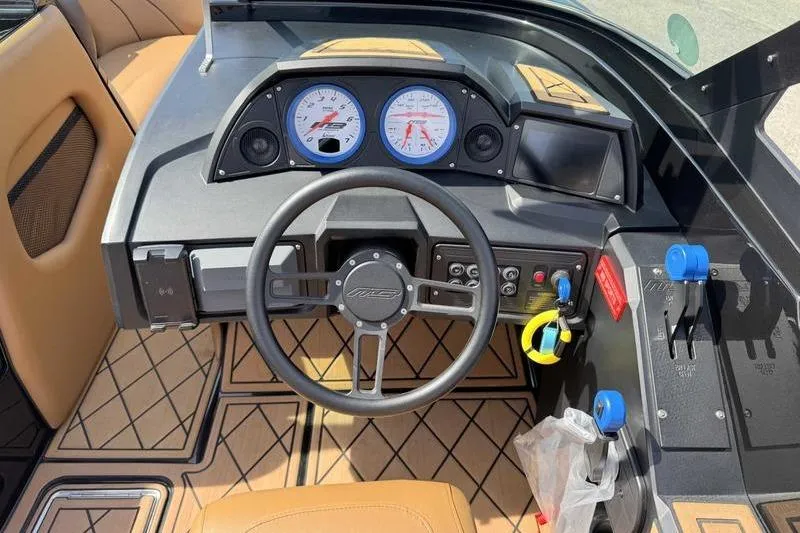 Slide: The Image of 2022 MB Sport B52 boat dashboard with steering wheel and control panel. - 5