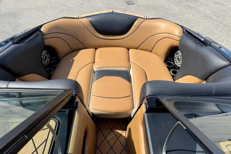 Slide: The Image of Luxurious interior of 2022 MB Sport B52 boat with tan and black seating. - 9