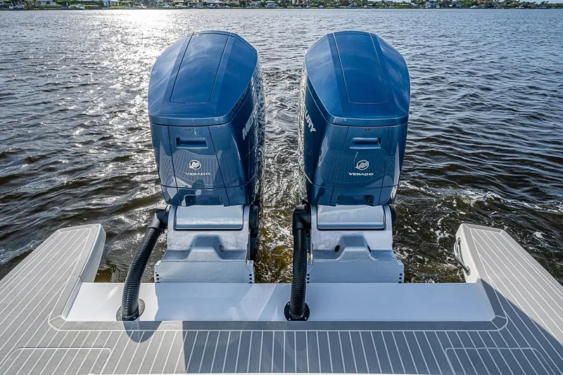 Slide: The Image of Twin Mercury Verado engines on 2024 Intrepid 41 Valor boat, cruising on open water. - 12