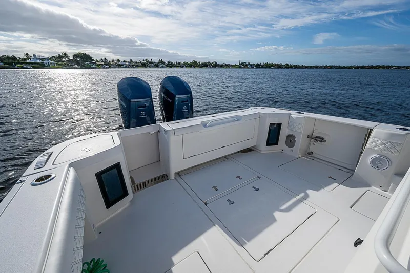 Slide: The Image of 2024 Intrepid 41 Valor boat deck with dual engines on a sunny day. - 14