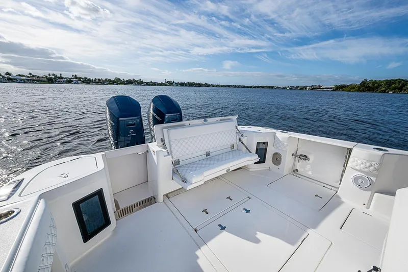 Slide: The Image of 2024 Intrepid 41 Valor boat deck with dual engines on a sunny day. - 16