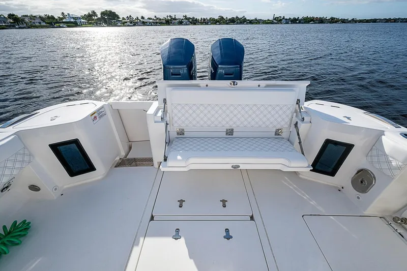 Slide: The Image of 2024 Intrepid 41 Valor boat with seating and twin engines on a sunny day. - 17