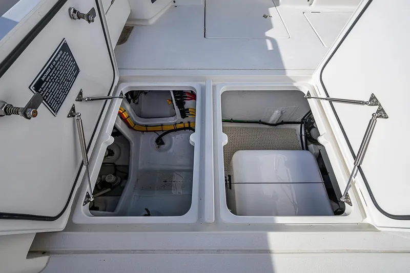 Slide: The Image of Open storage compartments on a 2024 Intrepid 41 Valor boat deck. - 20