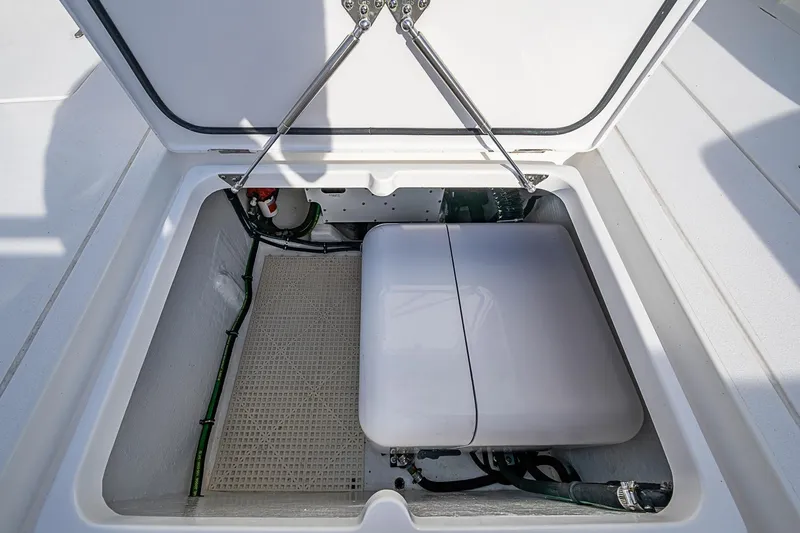 Slide: The Image of Open hatch of 2024 Intrepid 41 Valor boat showing storage compartment. - 22
