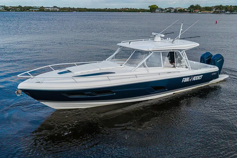 Slide: The Image of 2024 Intrepid 41 Valor boat cruising on calm waters. - 3