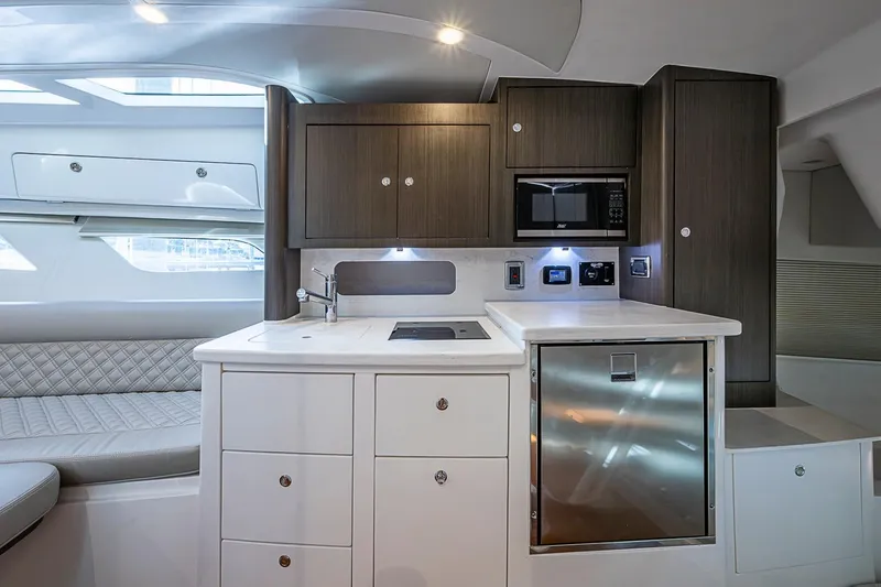 Slide: The Image of Luxurious interior of 2024 Intrepid 41 Valor yacht featuring modern kitchen amenities. - 35