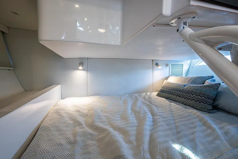 Slide: The Image of Luxurious cabin interior of 2024 Intrepid 41 Valor yacht with cozy bedding and modern lighting. - 37